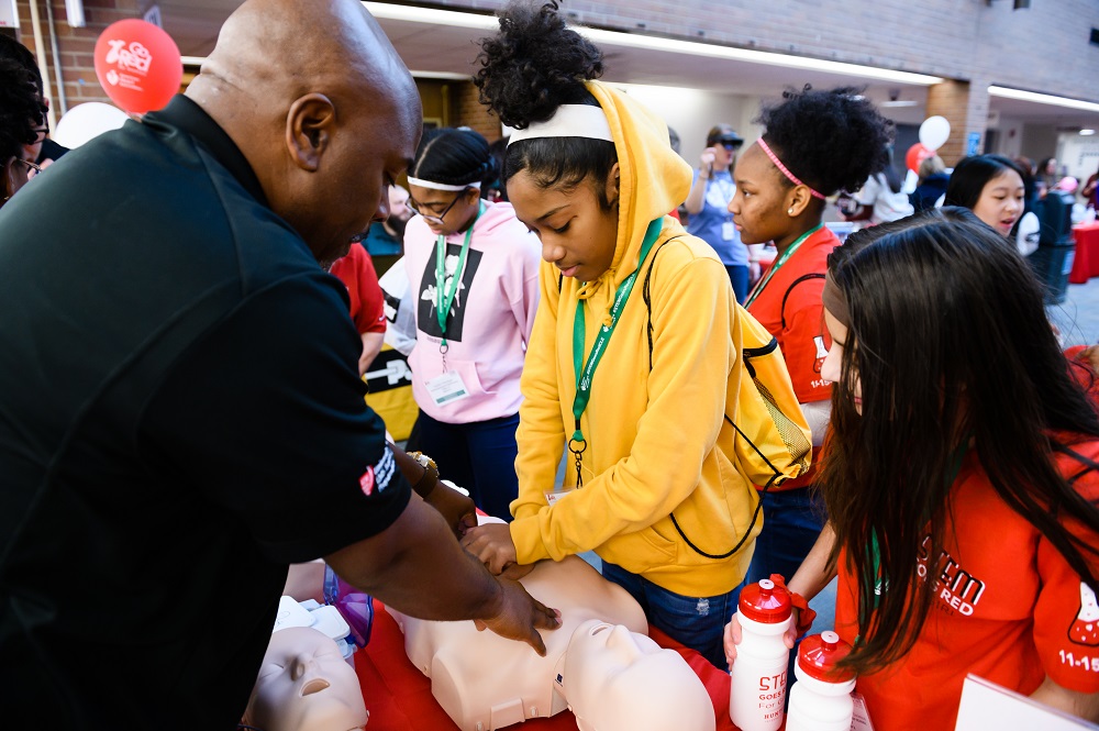 Girls learning CPR